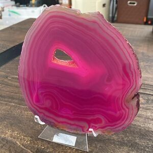 Huge pink agate slab with druzy crystals, with stand